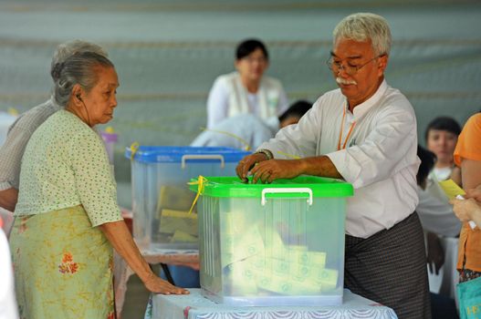 MYANMAR, Yangon: A man casts his ballot at a polling station in Yangon, on November 8, 2015. Myanmar goes to the polls in an historic election that could thrust opposition leader Aung San Suu Kyi's pro-democracy party into power and pull the country away from the grip of the military. 