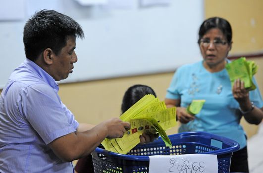 MYANMAR, Yangon: Staff counts the votes at a polling station in Yangon, Myanmar, on November 8, 2015. Myanmar goes to the polls in an historic election that could thrust opposition leader Aung San Suu Kyi's pro-democracy party into power and pull the country away from the grip of the military. 