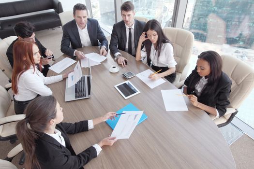 Business meeting of diverse people around the table