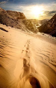 Mountains and sand dunes at the sunset