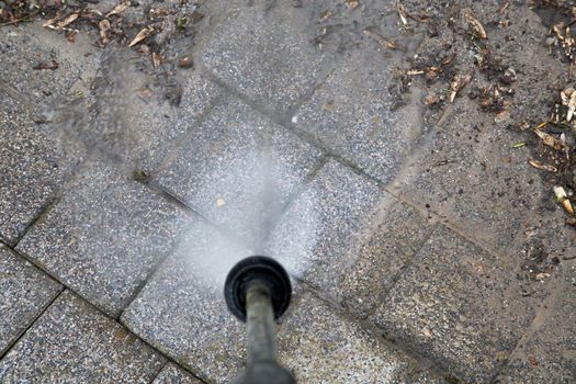 Outdoor floor cleaning with high pressure water jet