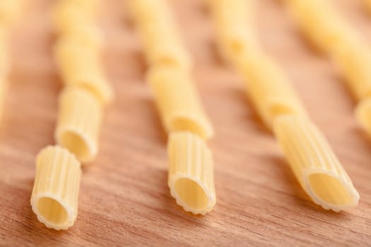 raw the pasta closeup on wooden background 