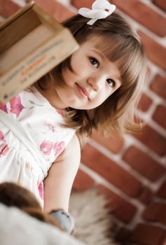 portrait of a baby on the background brick wall