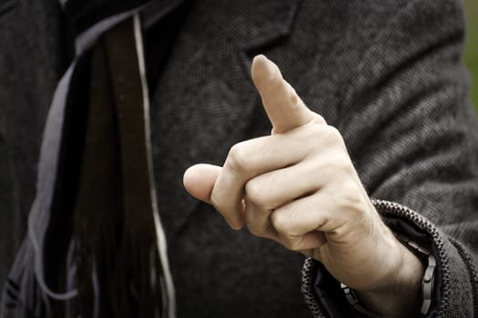 Businessman pointing at camera with his finger.