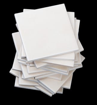 Stack of tiles on black backround, front view
