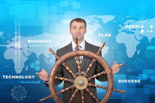 Businessman holding steering wheel on abstract background with world map