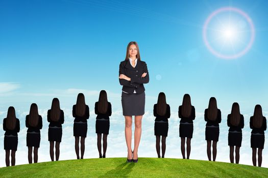 Businesslady with crossed arms and looking at camera