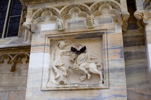 A decoration on famous gothic Milan cathedral in Italy
