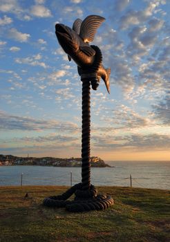 BONDI, AUSTRALIA - OCTOBER 25, 2015;  Annual Sculpture by the Sea free public event.  Exhibit titled Flying Fish by Gillie and Marc Schattner