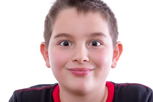 Head and Shoulders Close Up Portrait of Young Boy Wearing Black and Red Shirt Looking at Camera with Wide Eyes and Closed Mouth Smile in Studio on White Background