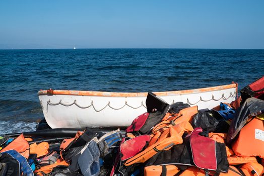 GREECE, Lesbos: The northern coast of the Greek island of Lesbos is covered with thousands of orange life jackets on November 8, 2015. A fresh group of refugees arrive under the supervision of the Greek and Turkish coast guards.  