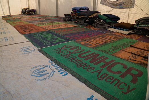 GREECE, Lesbos: A fresh group of refugees arrive under the supervision of the Greek and Turkish coast guards on November 8, 2015. Prayer mats are provided by UNHCR.