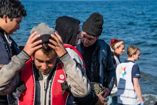 GREECE, Lesbos: A fresh group of refugees arrive under the supervision of the Greek and Turkish coast guards on November 8, 2015