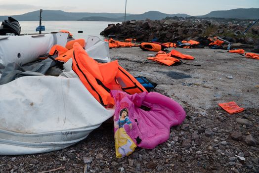 GREECE, Lesbos: The northern coast of the Greek island of Lesbos is covered with thousands of orange life jackets on November 8, 2015. A fresh group of refugees arrive under the supervision of the Greek and Turkish coast guards.  
