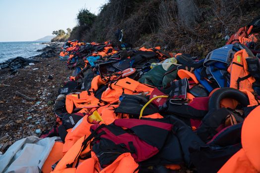 GREECE, Lesbos: The northern coast of the Greek island of Lesbos is covered with thousands of orange life jackets on November 8, 2015. A fresh group of refugees arrive under the supervision of the Greek and Turkish coast guards.  