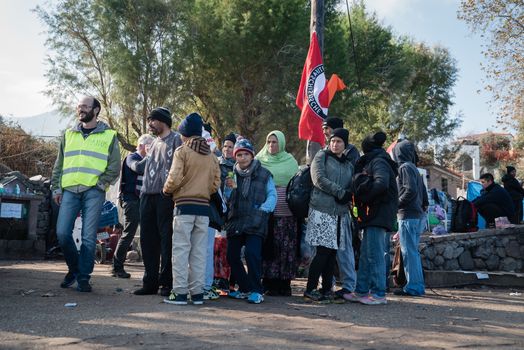 GREECE, Lesbos: A fresh group of refugees arrive under the supervision of the Greek and Turkish coast guards on November 8, 2015