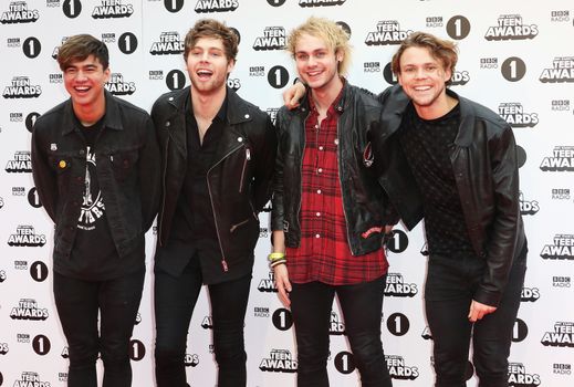 UNITED KINGDOM, London: (From left to right) Calum Hood, Luke Hemmings, Michael Clifford and Ashton Irwin of 5 Seconds of Summer attend BBC Radio 1's Teen Awards at Wembley Arena in London on November 8, 2015. 