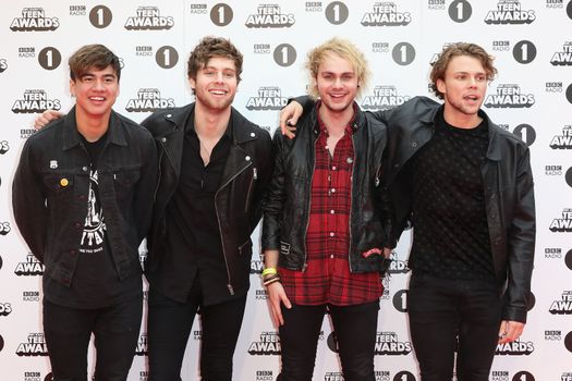 UNITED KINGDOM, London: (From left to right) Calum Hood, Luke Hemmings, Michael Clifford and Ashton Irwin of 5 Seconds of Summer attend BBC Radio 1's Teen Awards at Wembley Arena in London on November 8, 2015.