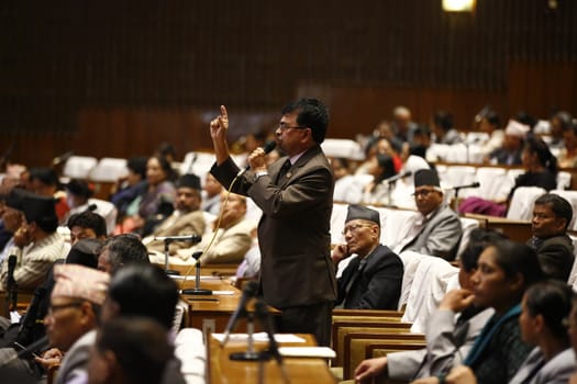 NEPAL, Kathmandu:  As unrest continues in Nepal surrounding the nation's new constitution, protesters from Nepal's indigenous Madhesi community disrupted a parliamentary meeting in Kathmandu on November 8, 2015. Demanding more government representation, these indigenous people have placed blockades at all border crossings with India for the past three months, moving Nepal closer and closer to a humanitarian crisis.  As the United Democratic Madhesi Front took the stage to disrupt the parliamentary meeting, lawmakers backing the protesters chanted pro-Madhesi slogans. 
