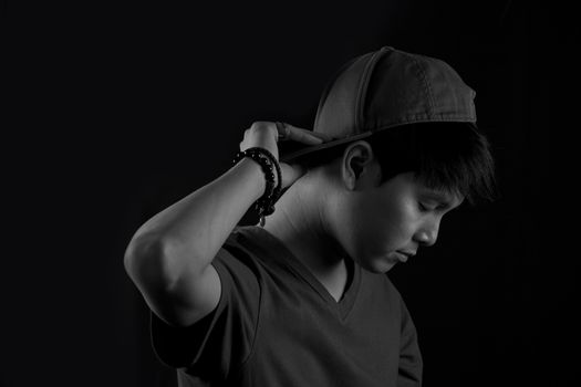 Portrait of Asian young man on black background