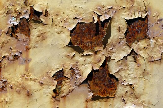 Detail of the flaking paint from rusty metal