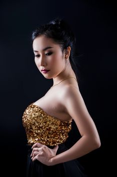 Portrait of beautiful Asian young girl on black background