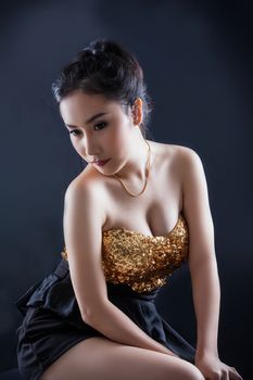 Portrait of beautiful Asian young girl on black background