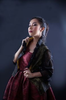 Portrait of beautiful Asian young girl on black background