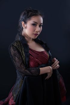 Portrait of beautiful Asian young girl on black background