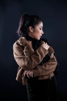 Portrait of beautiful Asian young girl on black background