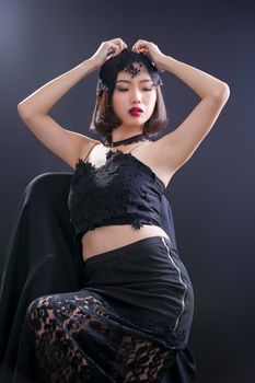 Portrait of beautiful Thai young girl on black background