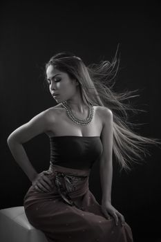 Portrait of Asian woman on black background
