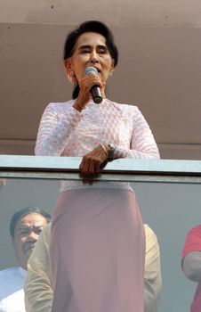 MYANMAR, Yangon: Myanmar opposition leader Aung San Suu Kyi delivers a speech from the balcony of the National League of Democracy (NLD) headquarters in Yangon on November 9, 2015. Aung San Suu Kyi's opposition party November 9 said they are on course to claim more than 70 percent of seats after Myanmar's poll, a gain that could bring a major power shift from the military. 