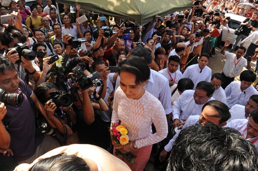MYANMAR, Yangon: Opposition leader Aung San Suu Kyi arrives at the National League for Democracy headquarters, in Yangon, to deliver a speech to hundreds of supporters on November 9, 2015. Aung San Suu Kyi's opposition party November 9 said they are on course to claim more than 70 percent of seats after Myanmar's poll, a gain that could bring a major power shift from the military.