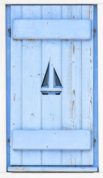 Sail boat on blue wooden shutter