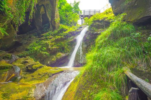 Grotto del Cagleron and waterfall in Italy