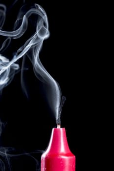Candle Stick With Smoke on black background.