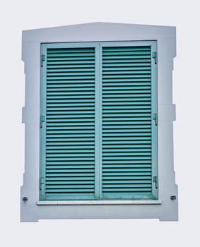 Closed green window shutter isolated on white background