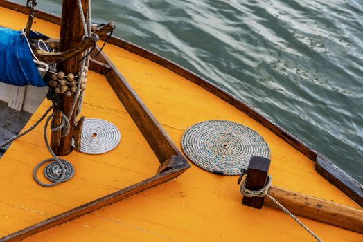 Detail of an orange vintage sail boat