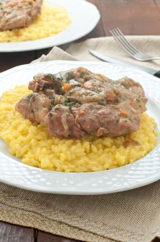 marrowbone, veal cut used in Italian cooking with yellow risotto alla milanese with safran