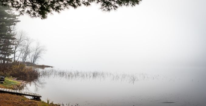 Still, cool air and warm lake water make for an early morning masking of the water in a near opaque fog show.