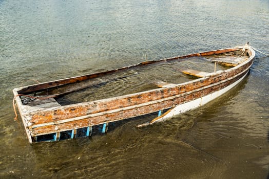 Sunk boat on mediterranean sea in Naples, Italy