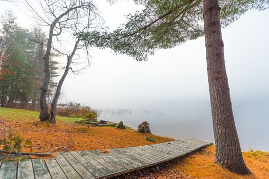 Still, cool air and warm lake water make for an early morning masking of the water in a near opaque fog show.