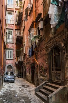 narrow street downtown the city of Naples, Italy