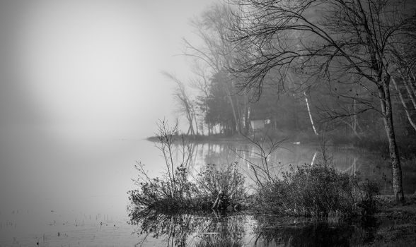 Still, cool air and warm lake water make for an early morning masking of the water in a near opaque fog show.