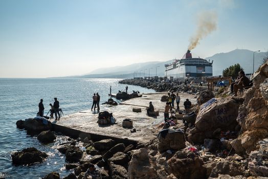 GREECE, Mytilene: Refugees wait to depart from Mytilene, the capital and port city of the Greek island of Lesbos, on November 7, 2015. From there, thousands of refugees will make their way to the Port of Piraeus.