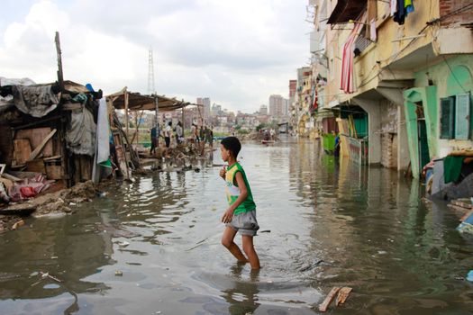 EGYPT, Alexandria: People are seen in the flooding road after a torrential rain caused flood in the Kafr El Arab neigborhood in west of Alexandria, Egypt on November 07, 2015.