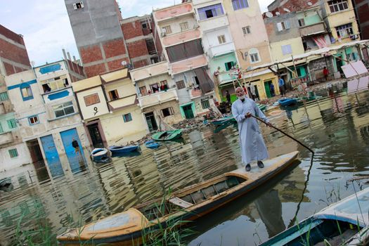 EGYPT, Alexandria: People are seen in the flooding road after a torrential rain caused flood in the Kafr El Arab neigborhood in west of Alexandria, Egypt on November 07, 2015.