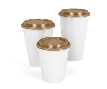Three paper coffee cups with brown lids on white background 