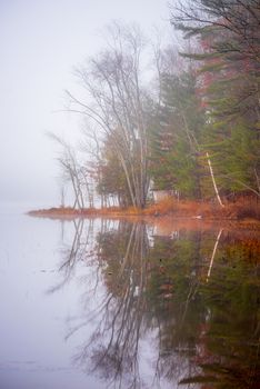 Still, cool air and warm lake water make for an early morning masking of the water in a near opaque fog show.